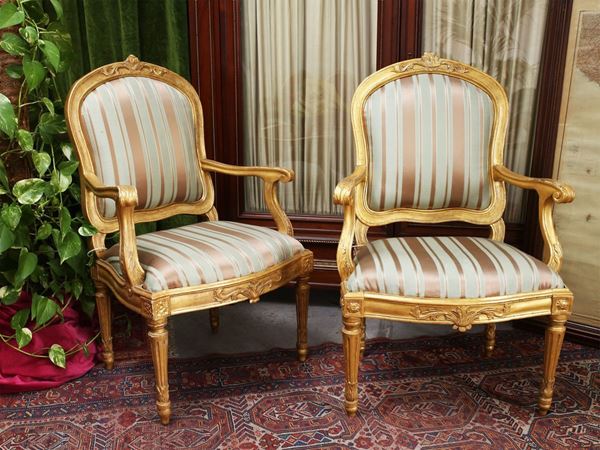 A set of six giltwood armchairs