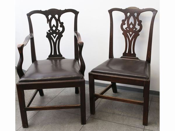 A set of four walnut chairs and a pair of armchair
