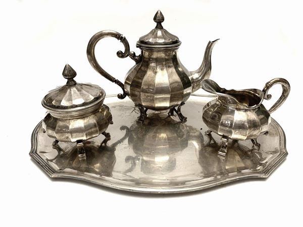 A silver solitaire tea set