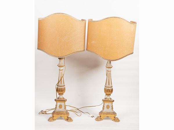 A pair of carved, white lacquered and giltwood torches