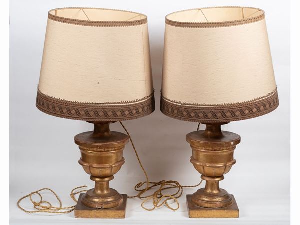 A pair of carved and giltwood palm holders