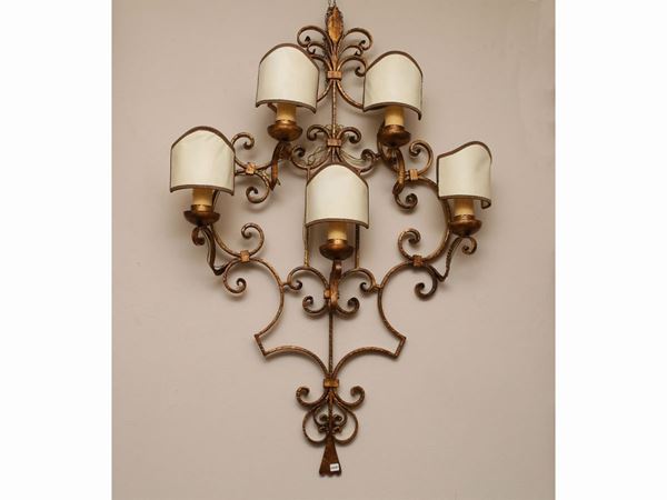 A large gilted wrougth iron sconce