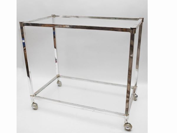 A crystal and chromed metal service cart