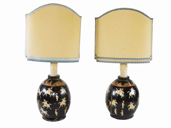 A pair of lacquered wooden vases