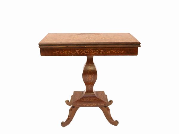 A mahogany veneered game table