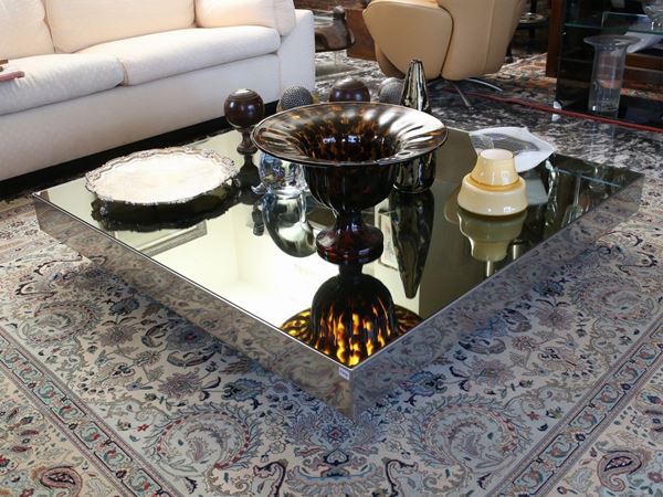 A glass and metal coffe table