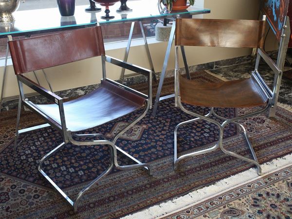 A couple of steel and leather chairs, Arrmet