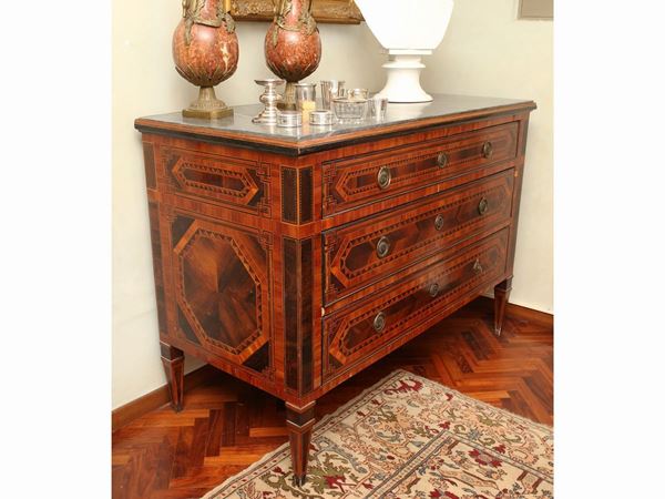 A walnut and other woods veneered chest of drawers