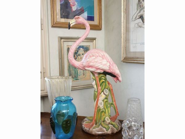 A ceramic flamingo statue