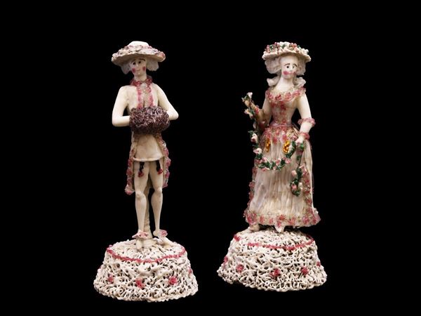 Pair of milk glass figurines with hot applications of polychrome decorations. Defects.