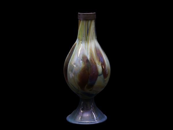 Vase in chalcedony in the shape of a bottle in glass paste streaked  with blue, brown and green