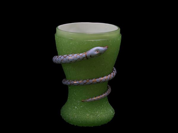 Glass in green and milk glass with hot application of a blue snake.