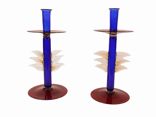 A pair of ruby red and cobalt blown glass candlesticks with leaves gold inclusions applied hot