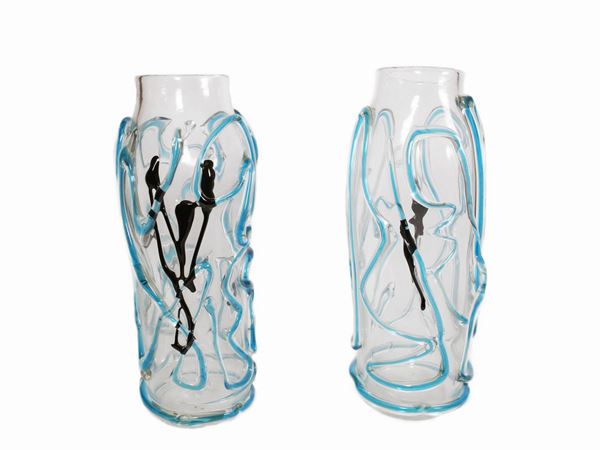 A pair of colorless glass vases with irregularapplications of turquoise threads.
