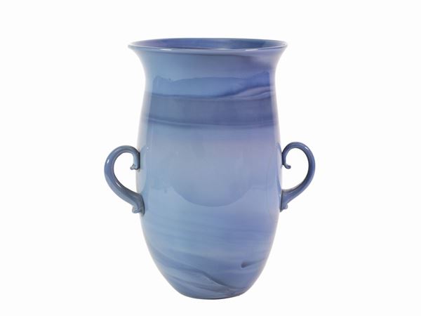 A glass vase in blue chalcedony with hot applied handles.