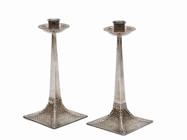 A pair of silver chandeliers