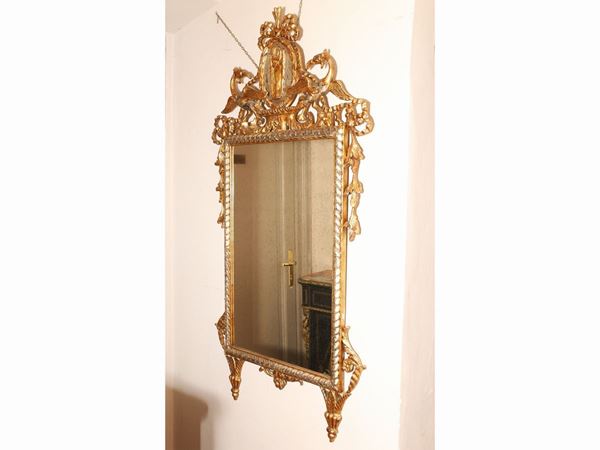 A small giltwood and carved mirror