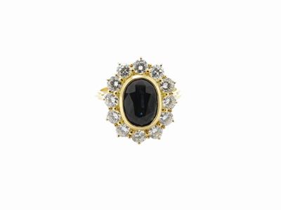Anello in Oro Giallo con Diamanti e Zaffiro