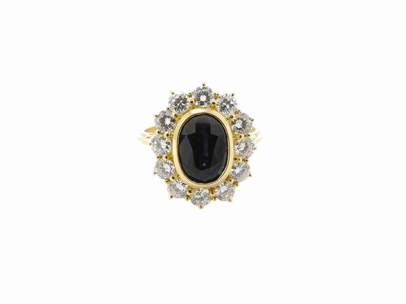 Anello in Oro Giallo con Diamanti e Zaffiro