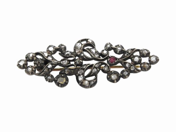 Yellow gold and silver brooch with diamonds and ruby
