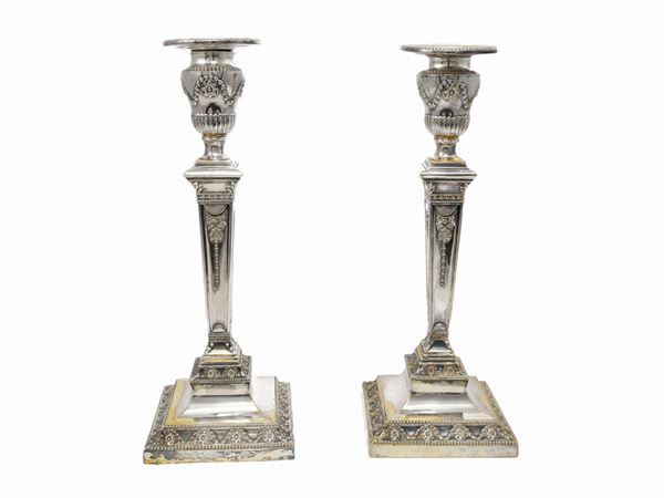 A couple of silverplated candlesticks