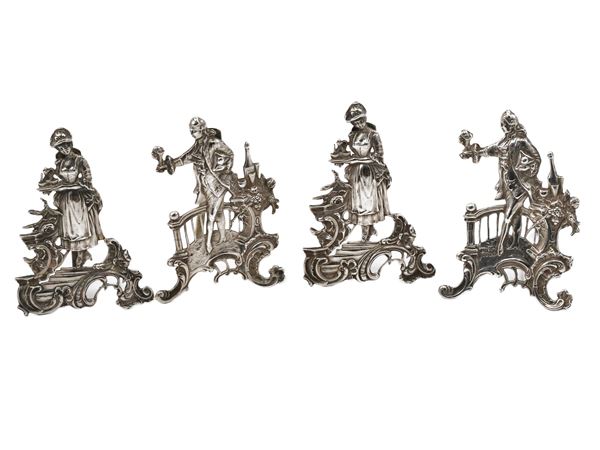 A set of four silver placeholders
