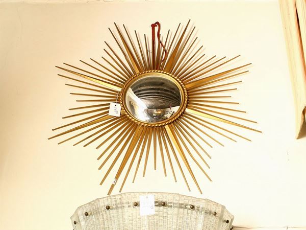 A pair of convex mirrors with brass frames