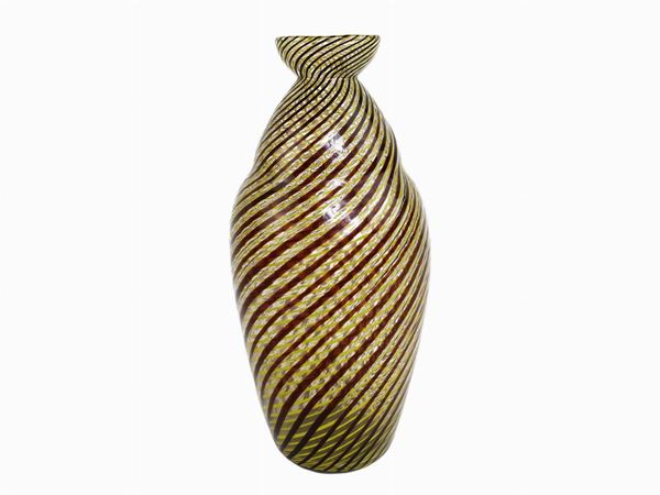 Blown glass jar with yellow and brown colored canes arranged in a spiral