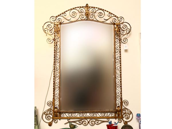 A gilted wrougth iron mirror