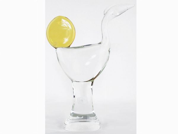 Transparent glass figure with yellow heat application