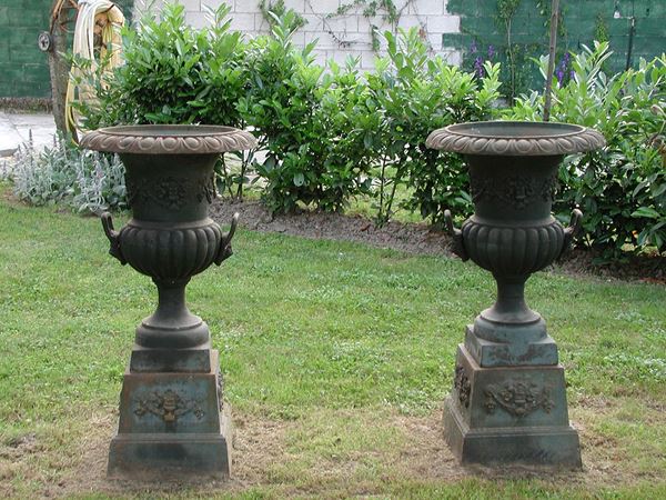 A pair of large cast iron garden medicean vases