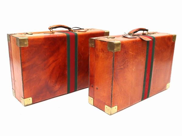 Two brown leather suitcases