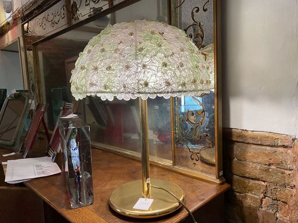 A blown glass and gilted metal table lamp
