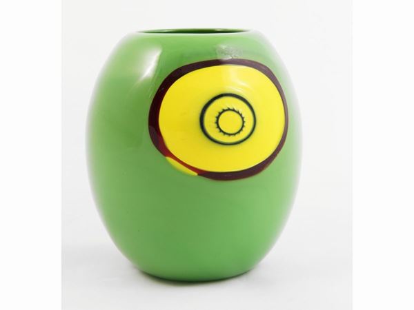 Green glass jar with inclusion of a large yellow murrina