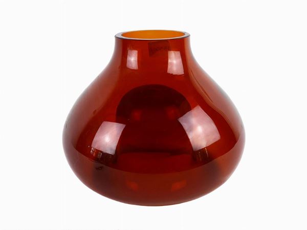 Thick glass vase in orange color