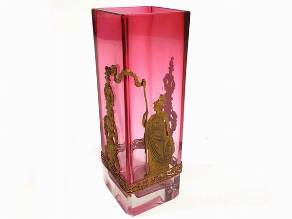 Ruby-colored Baccarat vase with applications of classic figures in gilded metal.