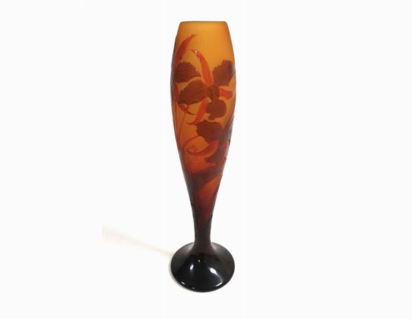 A D'Argental vase in cameo glass with orchid decoration in shades on a dark honey background. Signed