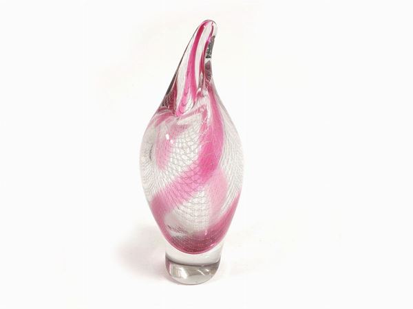 A crystal vase in lace with ruby red inclusion inside.