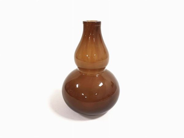 Brown opaline glass vase with an evident oriental shape.