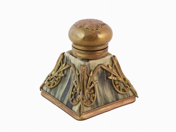 An inkwell in green glass and gilded copper