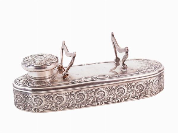 An inkwell in sterling silver