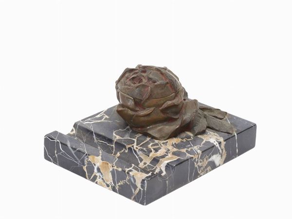 An inkwell with rose in bronze