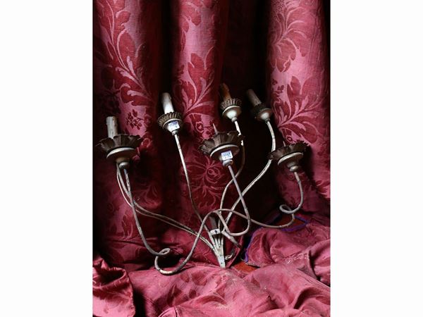 Two pairs of lacquered wrought iron wall lights