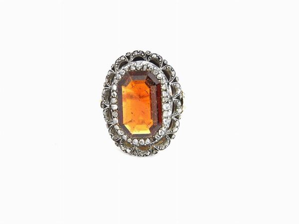 Gold and silver ring with diamonds and hessonite garnet