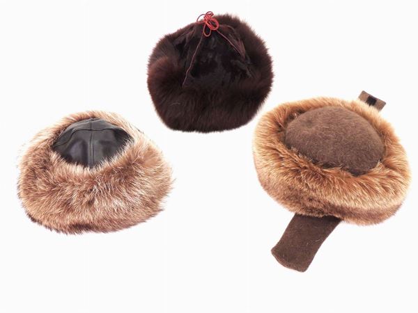 Three leather and fur hats