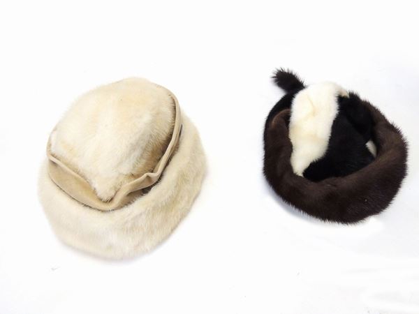 Three fur hats and a bag