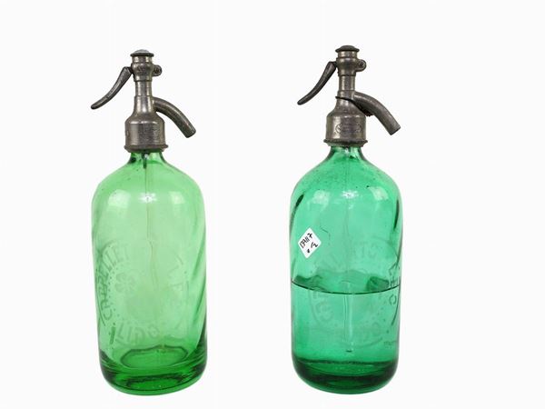Two seltzer siphons in glass and metal