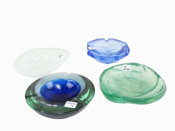 Four glass and crystal ashtrays