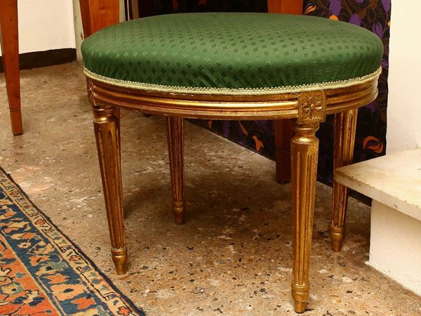 Stool in carved and gilded wood