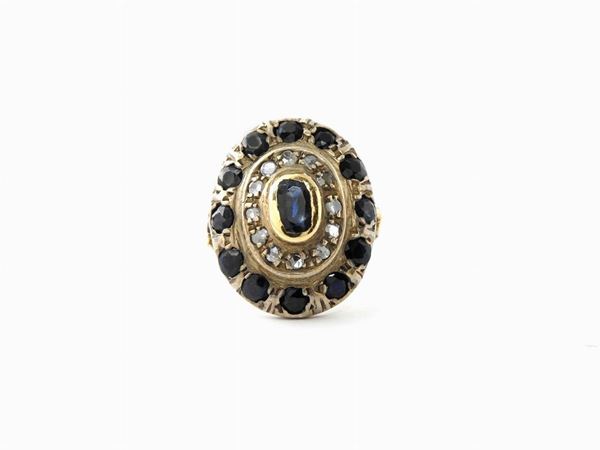 Yellow and silver gold ring with diamonds and sapphires